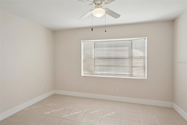 unfurnished room with light tile patterned flooring and ceiling fan