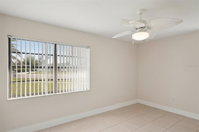 unfurnished room featuring light tile patterned floors and ceiling fan