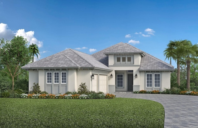 view of front of house featuring a garage and a front lawn