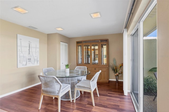 dining room with dark wood-type flooring