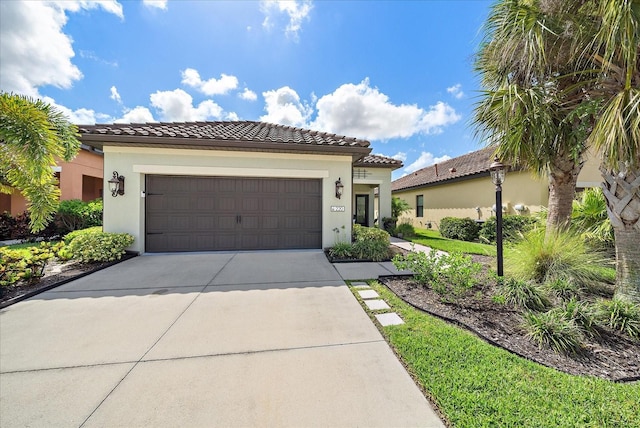 mediterranean / spanish-style house featuring a garage