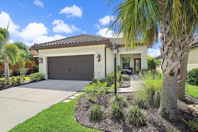 mediterranean / spanish-style home with a garage