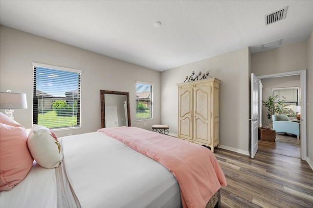 bedroom featuring wood-type flooring