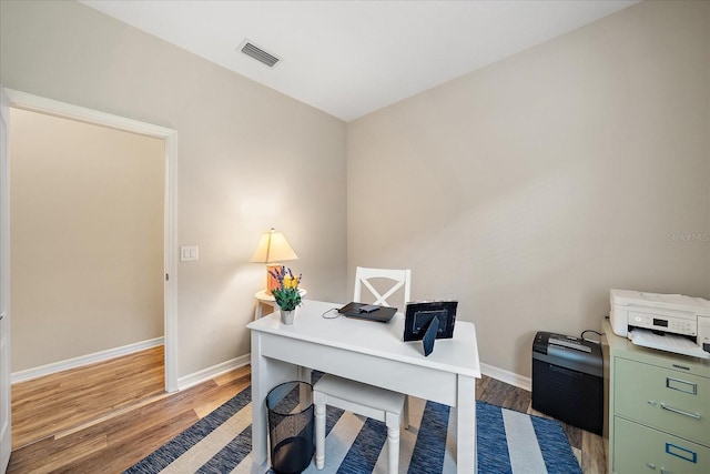 office area featuring dark wood-type flooring