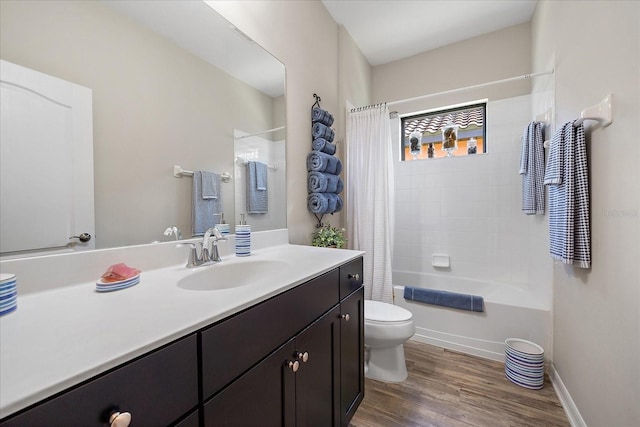 full bathroom with shower / tub combo, vanity, toilet, and hardwood / wood-style floors