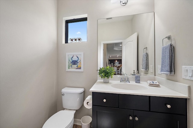 bathroom with vanity and toilet