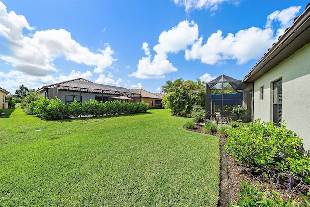 view of yard with a lanai