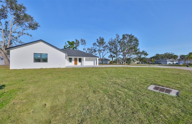 view of front facade with a garage and a front lawn