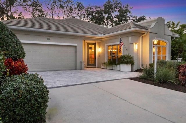 view of front of property with a garage