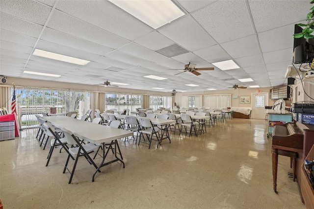 dining area with a paneled ceiling