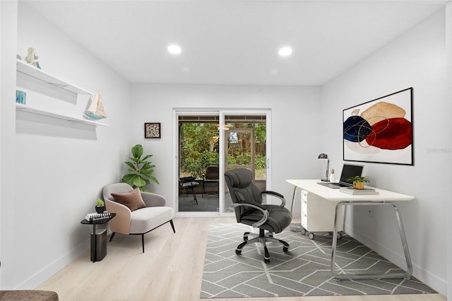 office space with wood-type flooring