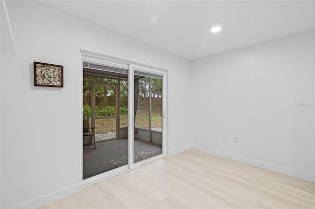 unfurnished room featuring light hardwood / wood-style flooring