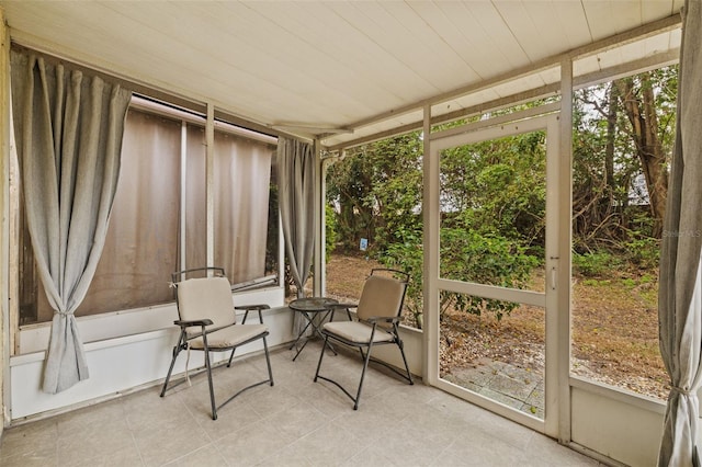 sunroom featuring wooden ceiling