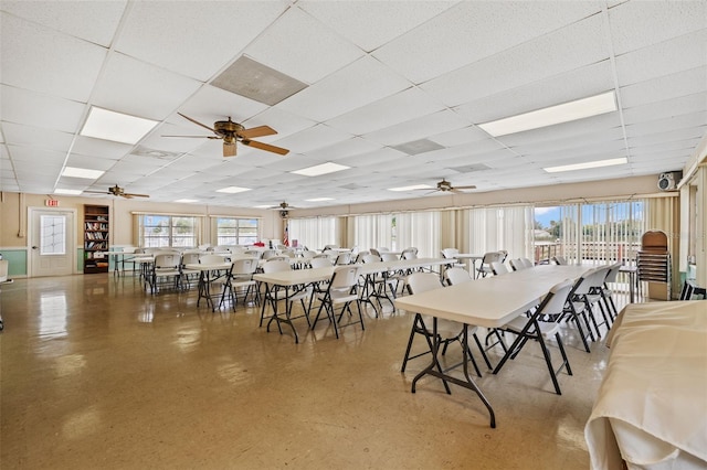 dining area featuring plenty of natural light and a paneled ceiling