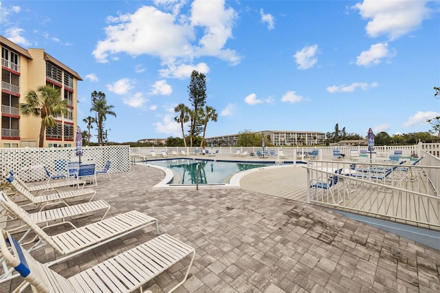 view of swimming pool with a patio area