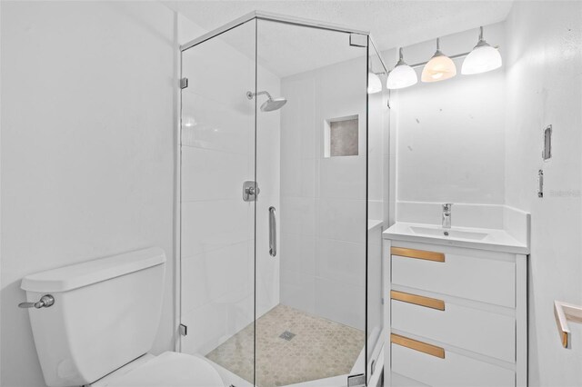 4126 Heron Way Unit B113, Bradenton, FL 34205 - bathroom featuring a sink, toilet, and a stall shower
