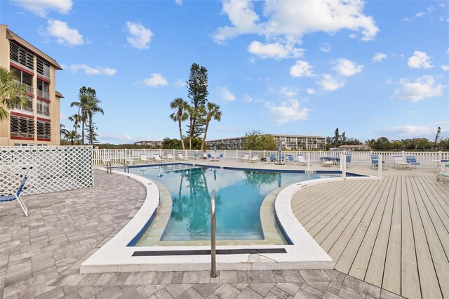 4126 Heron Way Unit B113, Bradenton, FL 34205 - community pool featuring fence and a patio area