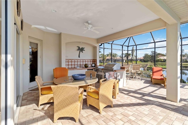 view of patio / terrace with grilling area, a lanai, and ceiling fan