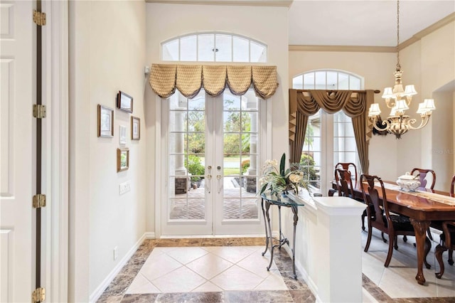 entryway featuring an inviting chandelier and ornamental molding