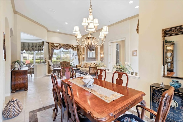 dining room featuring an inviting chandelier, crown molding, and light tile patterned flooring