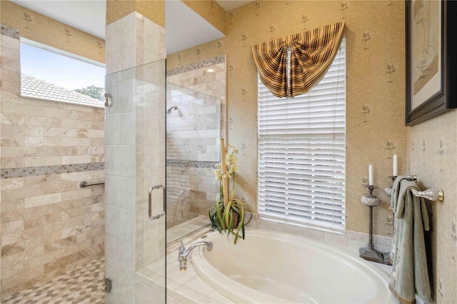 bathroom with shower with separate bathtub