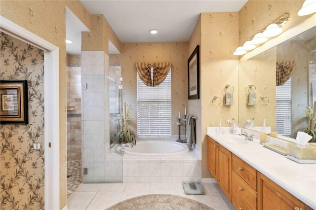 bathroom with tile patterned flooring, vanity, and independent shower and bath