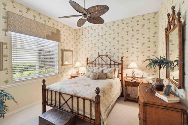 bedroom featuring light carpet and ceiling fan