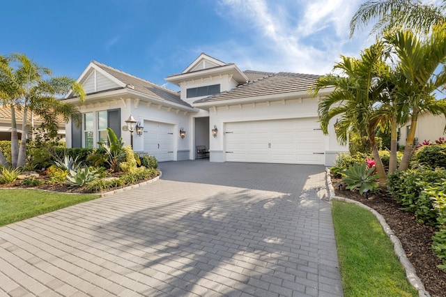 view of front of property with a garage