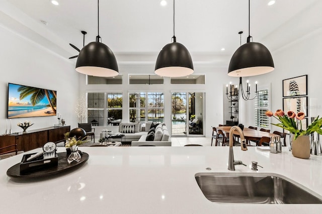 kitchen with pendant lighting, sink, and a healthy amount of sunlight