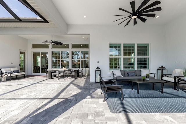 view of patio featuring an outdoor living space and ceiling fan