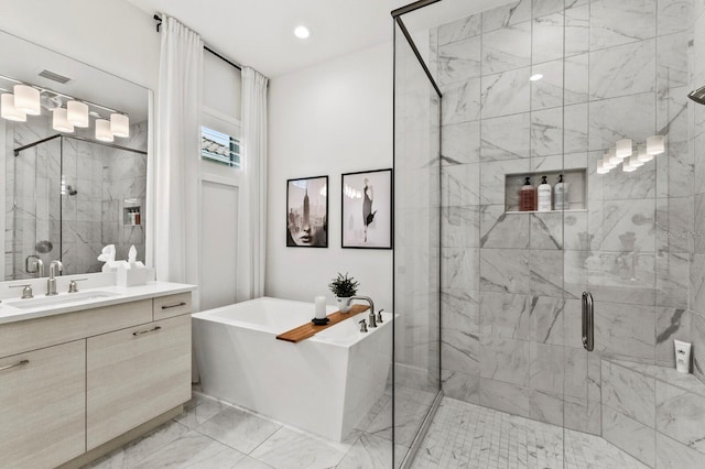 bathroom with vanity and separate shower and tub