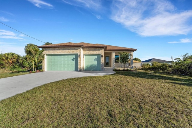 view of front of home with a garage and a front lawn