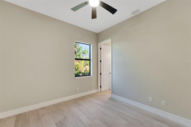 empty room featuring ceiling fan and light wood-type flooring