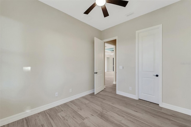 unfurnished bedroom featuring ceiling fan and light hardwood / wood-style floors