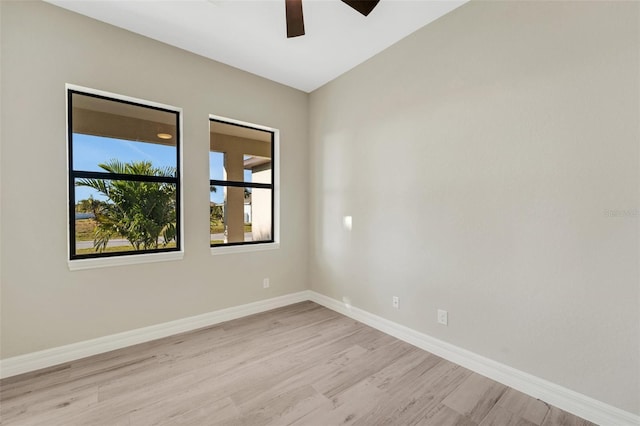 spare room featuring ceiling fan and light hardwood / wood-style floors