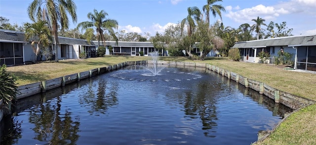 view of dock featuring a water view and a lawn