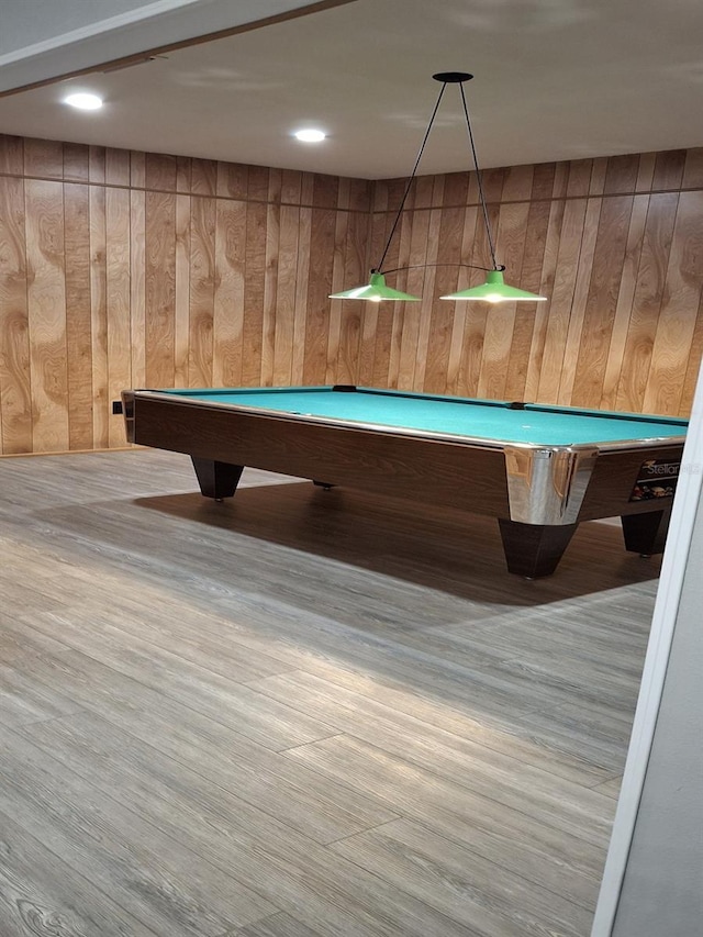 playroom featuring wood walls and billiards