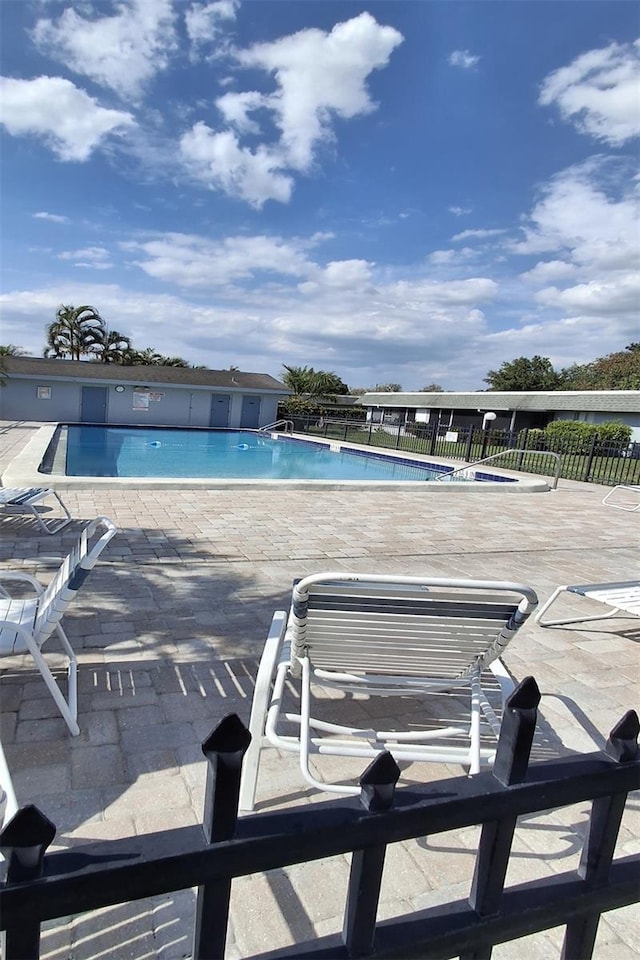 view of pool featuring a patio