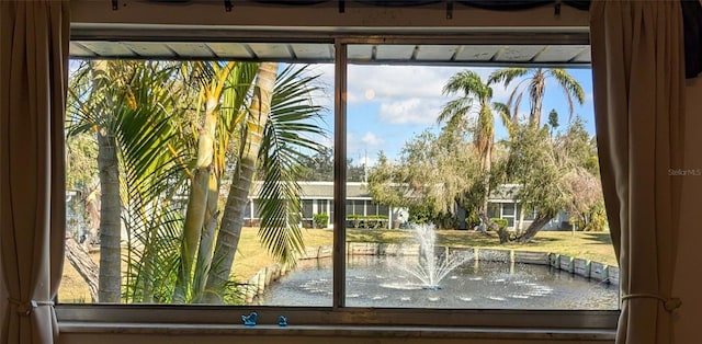 doorway to outside featuring a water view