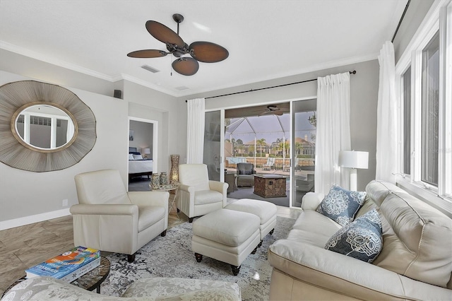 living room featuring crown molding and ceiling fan