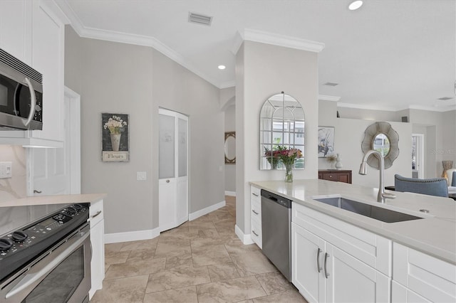 kitchen with stainless steel appliances, crown molding, sink, and white cabinets