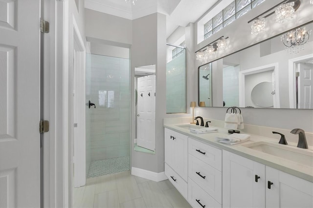 bathroom featuring tiled shower, vanity, and ornamental molding