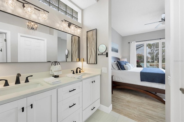 bathroom featuring vanity, plenty of natural light, tile patterned floors, and ceiling fan