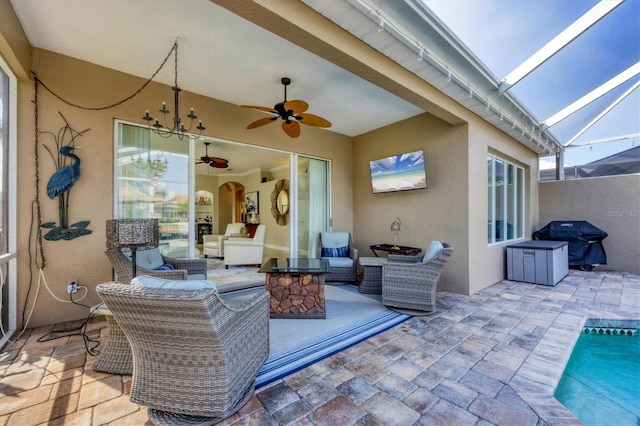 view of patio / terrace with a grill, a lanai, a pool, and ceiling fan