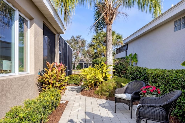 view of patio with a sunroom