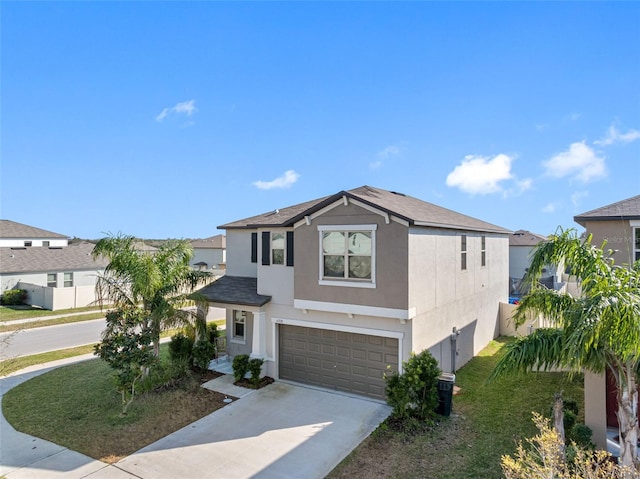 view of front of home with a garage and a front lawn