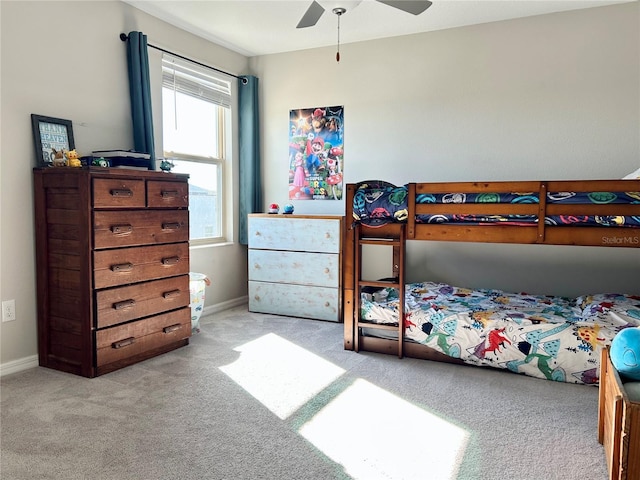 bedroom with ceiling fan and light colored carpet