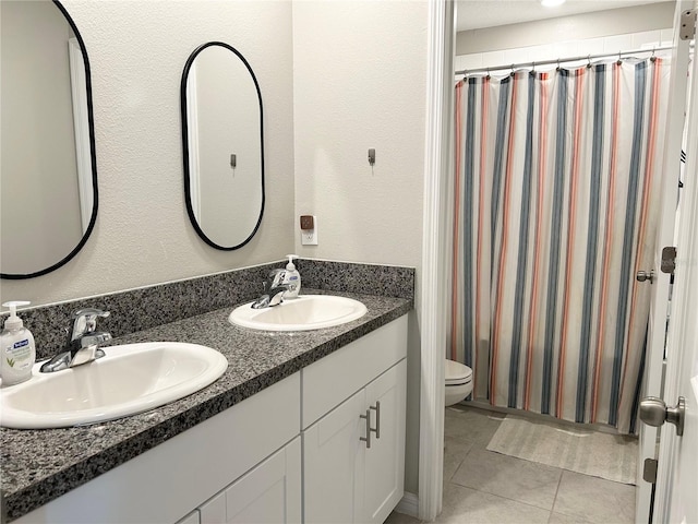 full bathroom with vanity, tile patterned floors, shower / bath combination with curtain, and toilet