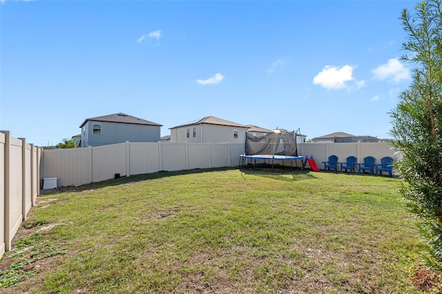 view of yard featuring a trampoline