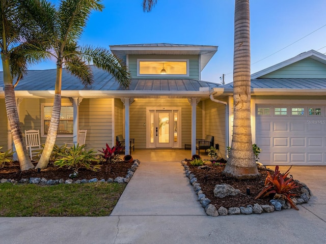 view of front of house with a garage and a porch